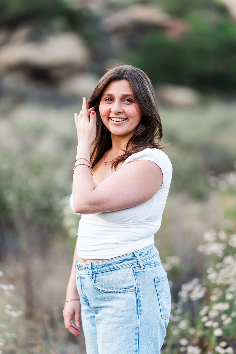 Outdoor graduation photos of a high school senior at Corriganville Park in Simi Valley, capturing smiles and scenic trails.