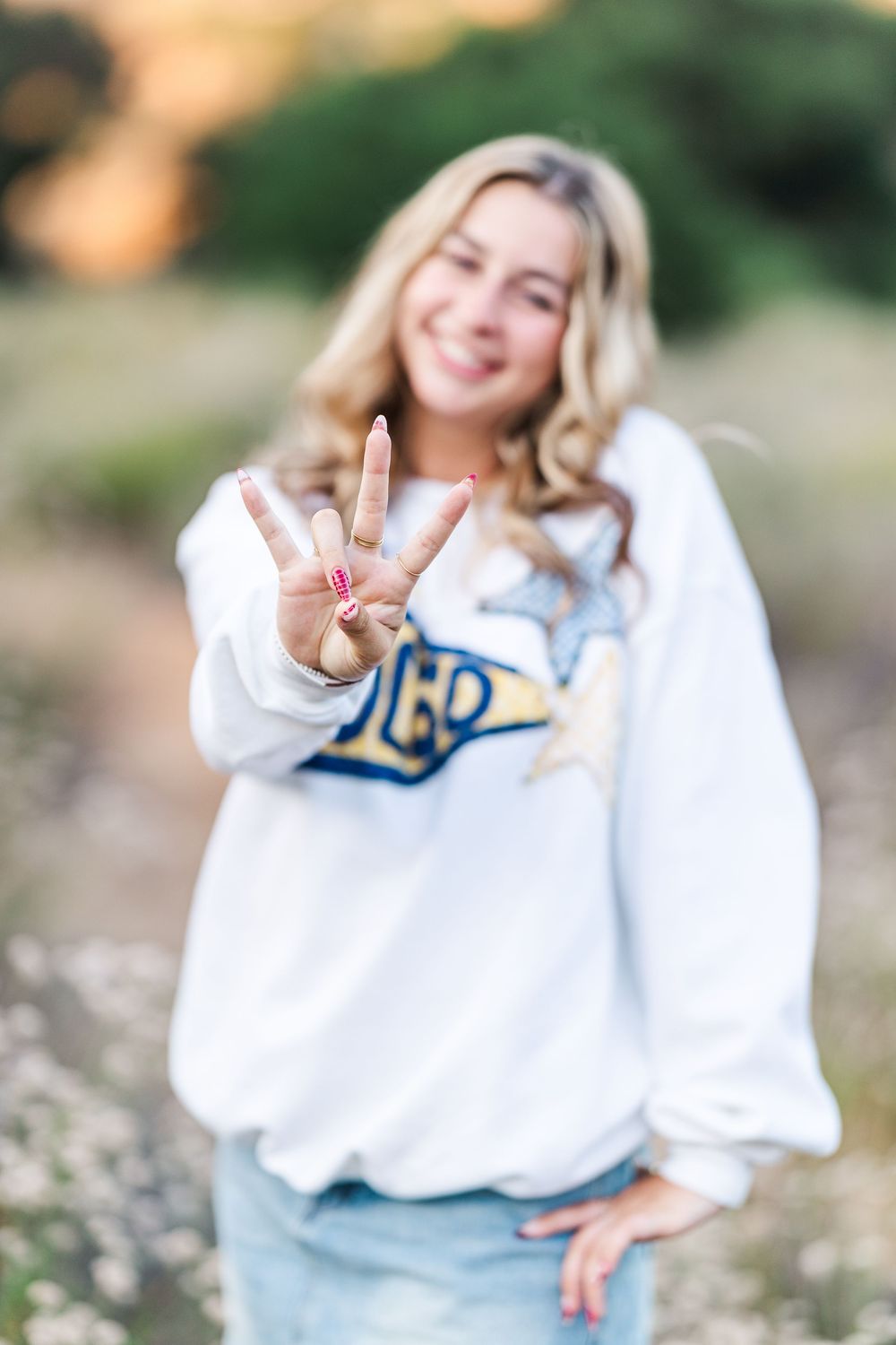 Outdoor graduation photos of a high school senior at Corriganville Park in Simi Valley, capturing smiles and scenic trails.