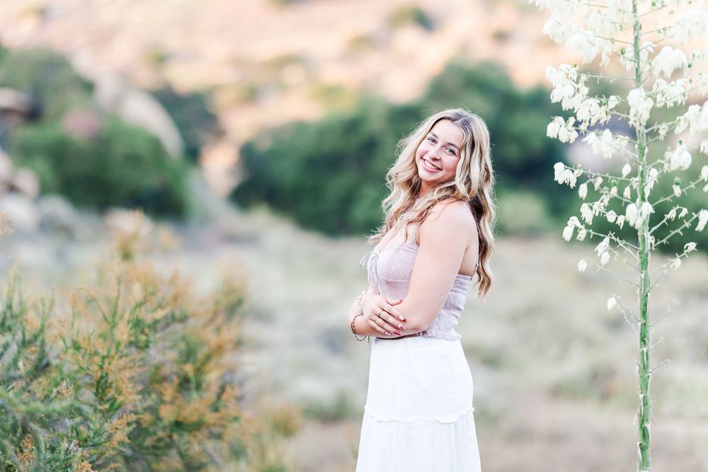 Outdoor graduation photos of a high school senior at Corriganville Park in Simi Valley, capturing smiles and scenic trails.