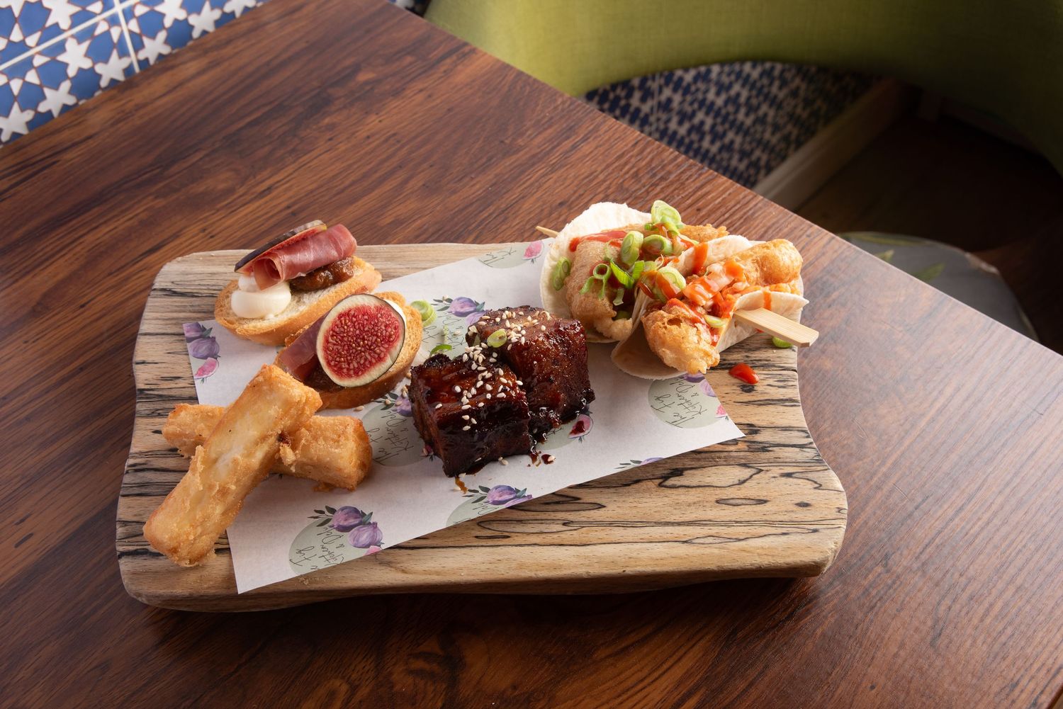 Artisan sharing board with pork belly, fish tacos, and fig crostini by The Fig Great Malvern  professional food photography by Helen Yandell