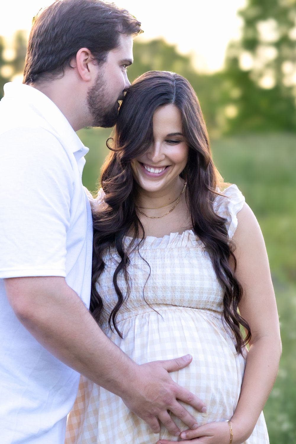 Wildflower maternity session with couple expecting their first child in Watkinsville GA