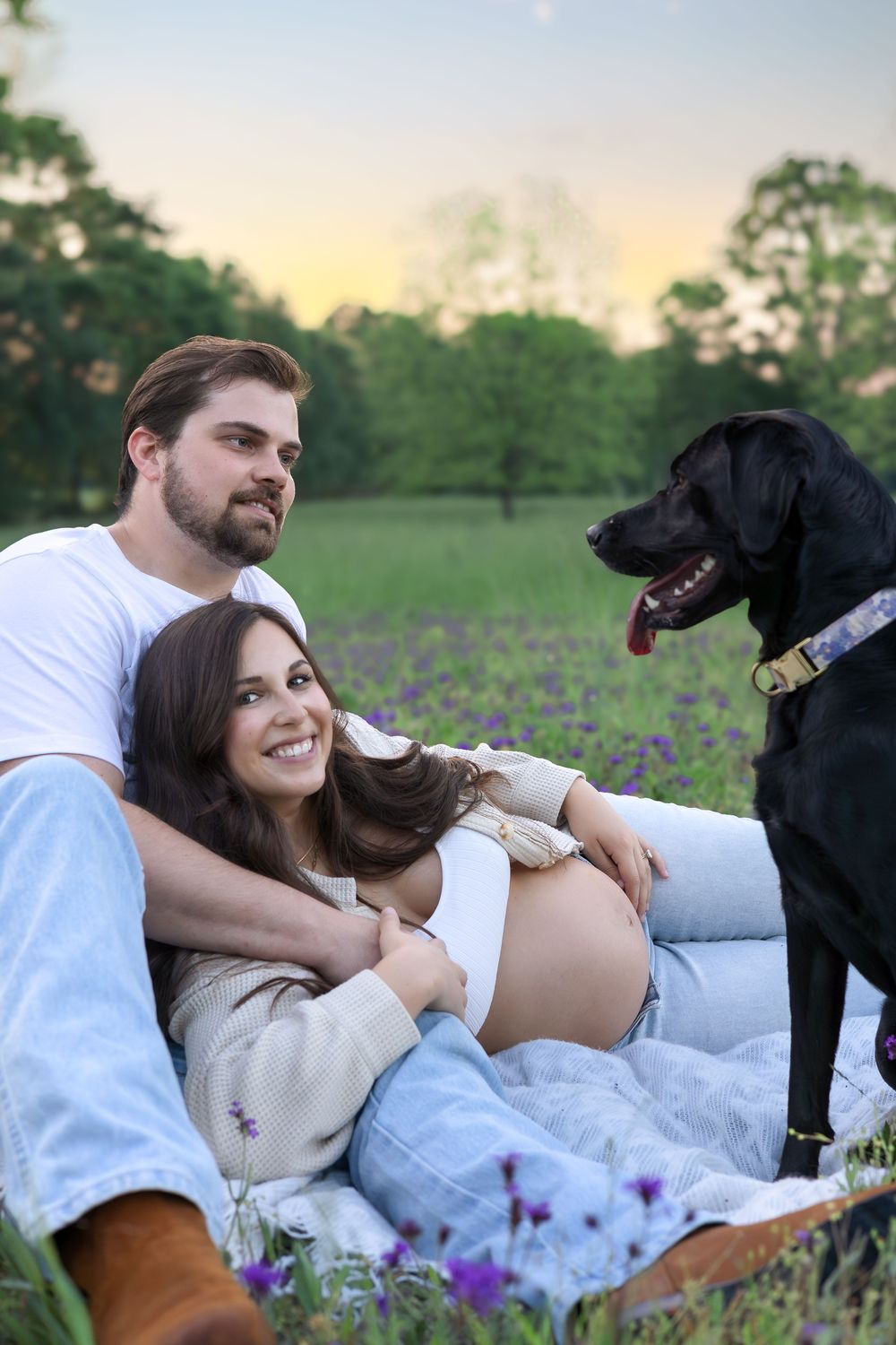 Maternity session in purple wildflowers with dog and expecting couple — lifestyle photographer in Athens Georgia