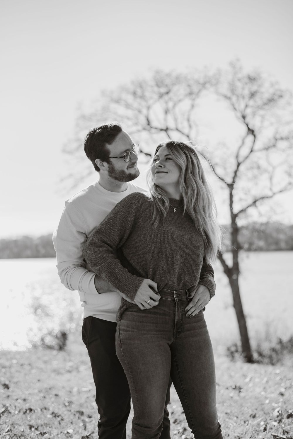 A couple posing together in a field at Houston Woods Park.