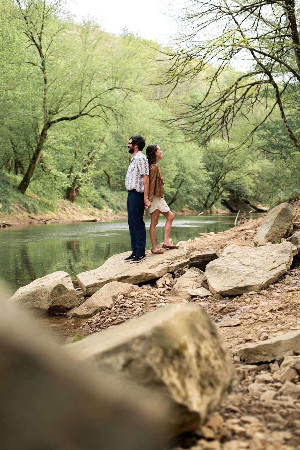 A couple on a rock in the summer at Red River Gorge, Kentucky.
