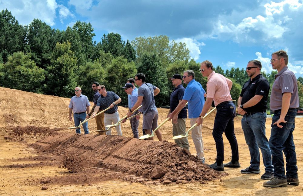 Corporate event photo of dignitaries with golden shovels at Baltimore County groundbreaking.