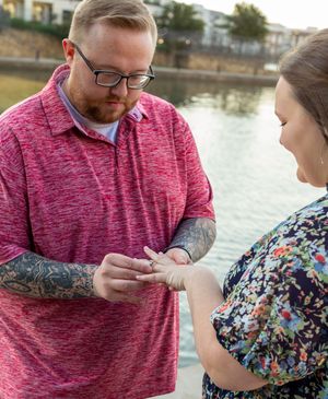 Engagement moment captured in sequence by waterfront during sunset. Proposal Engagement couples session Fort worth Dallas Texas