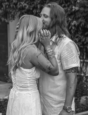 A tender embrace captured in black and white with a romantic outdoor backdrop. proposal engagement couples session fort worth dallas texas