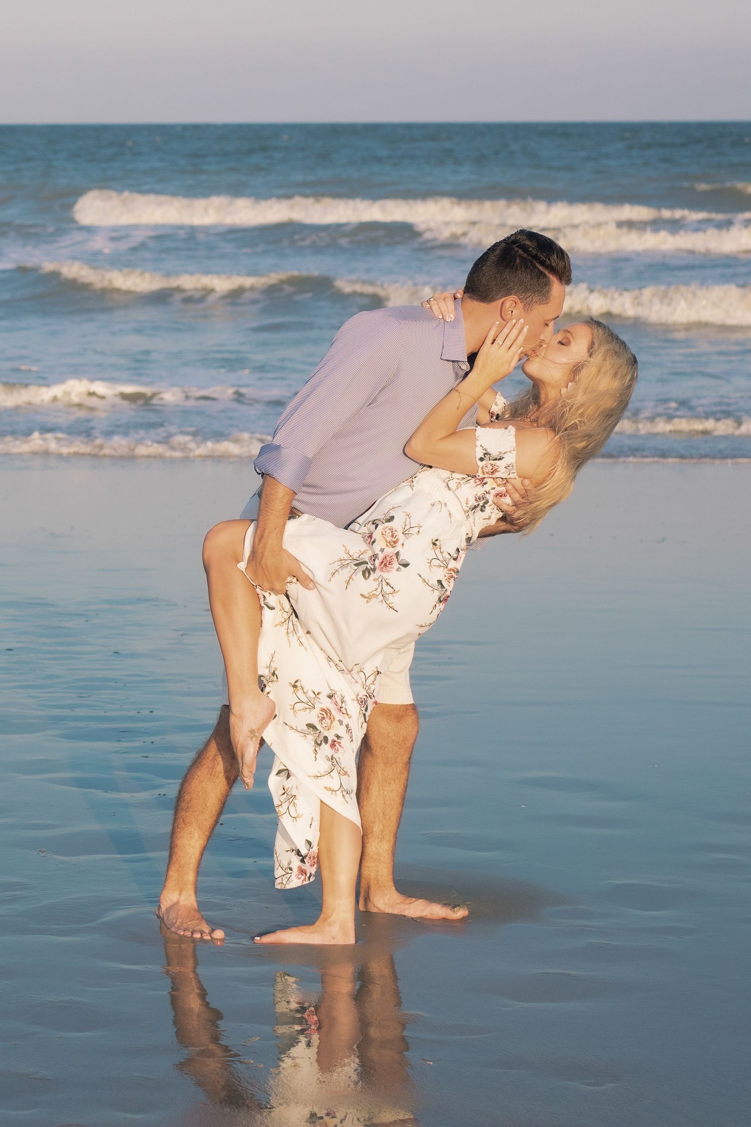 Outdoor couples portrait on the beach at golden hour, photographed by a Windsor-based professional, Tasha Cannaday