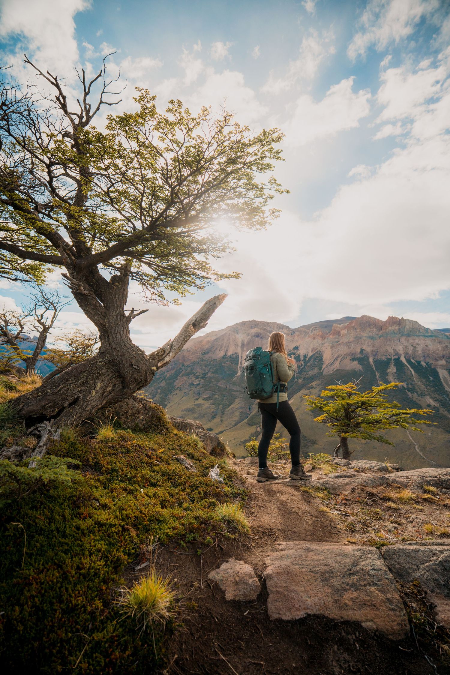 Woman hiking with a backpack in a beautiful mountain landscape
