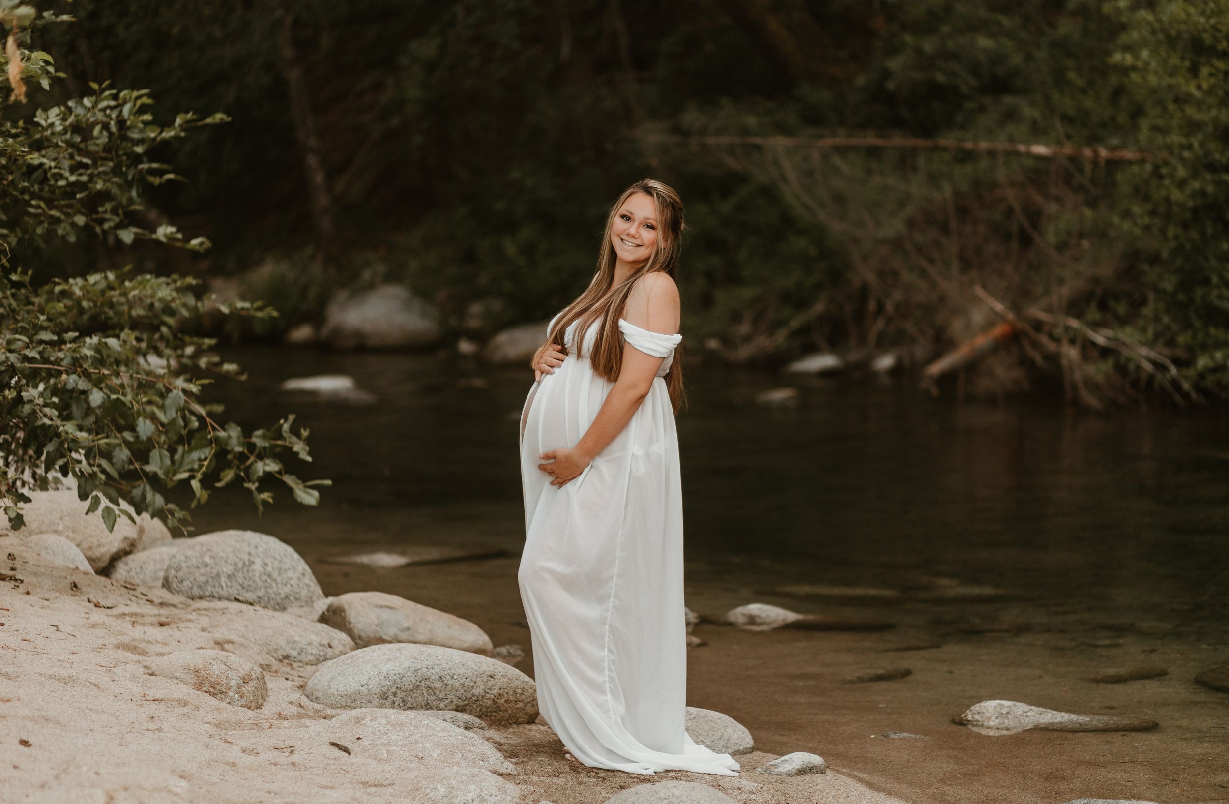 Panoramic riverside scene with soft natural lighting and muted earth tones.