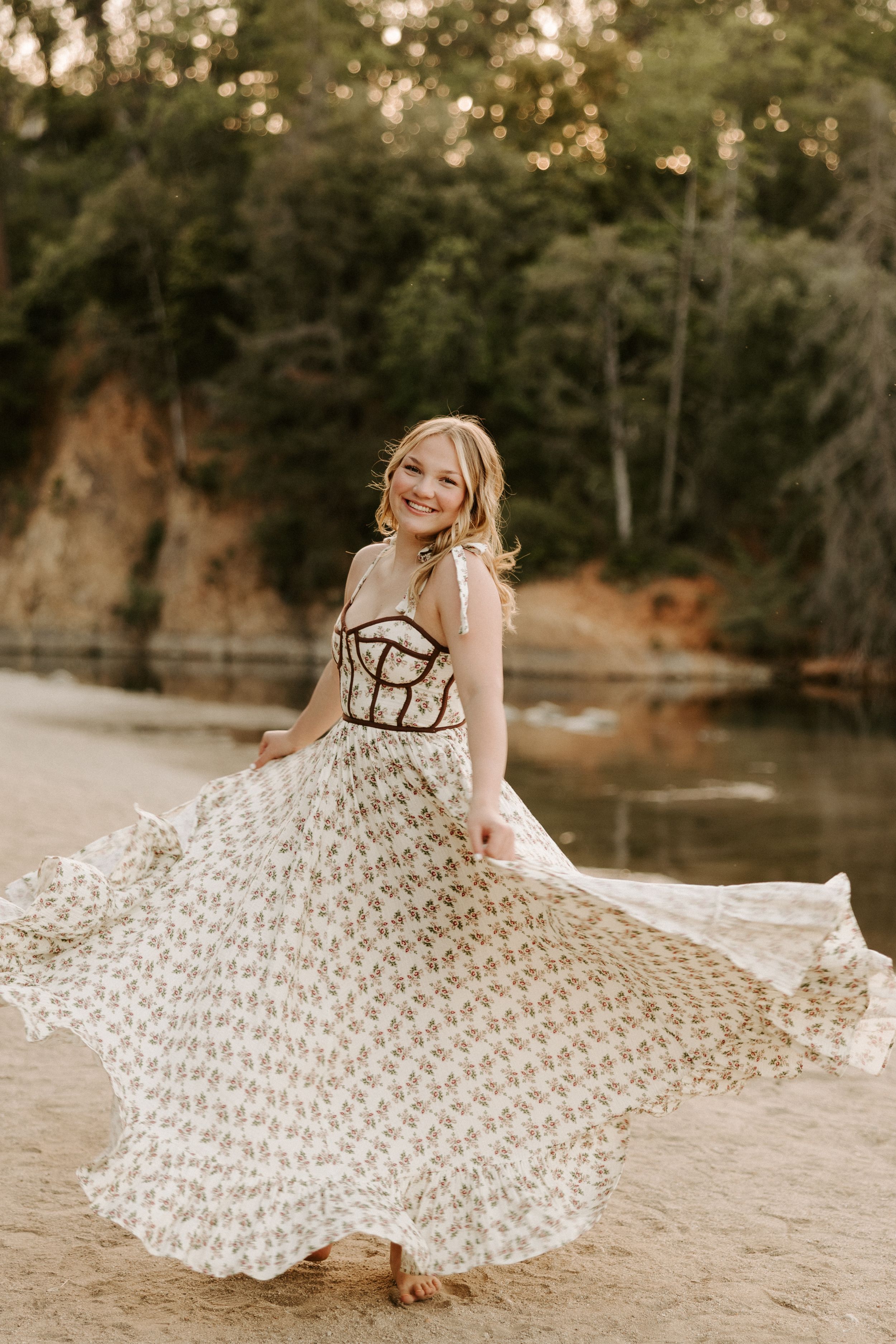 Artistic beach portraits featuring a flowing white patterned dress against natural scenery.