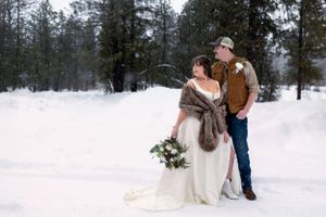 snowy winter elopement in Idaho City couple's portrait looking away