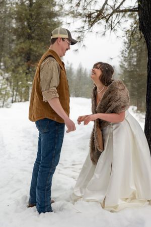 snowy winter elopement in Idaho City ceremony laughing