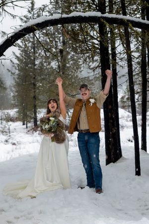 snowy winter elopement in Idaho City celebrating