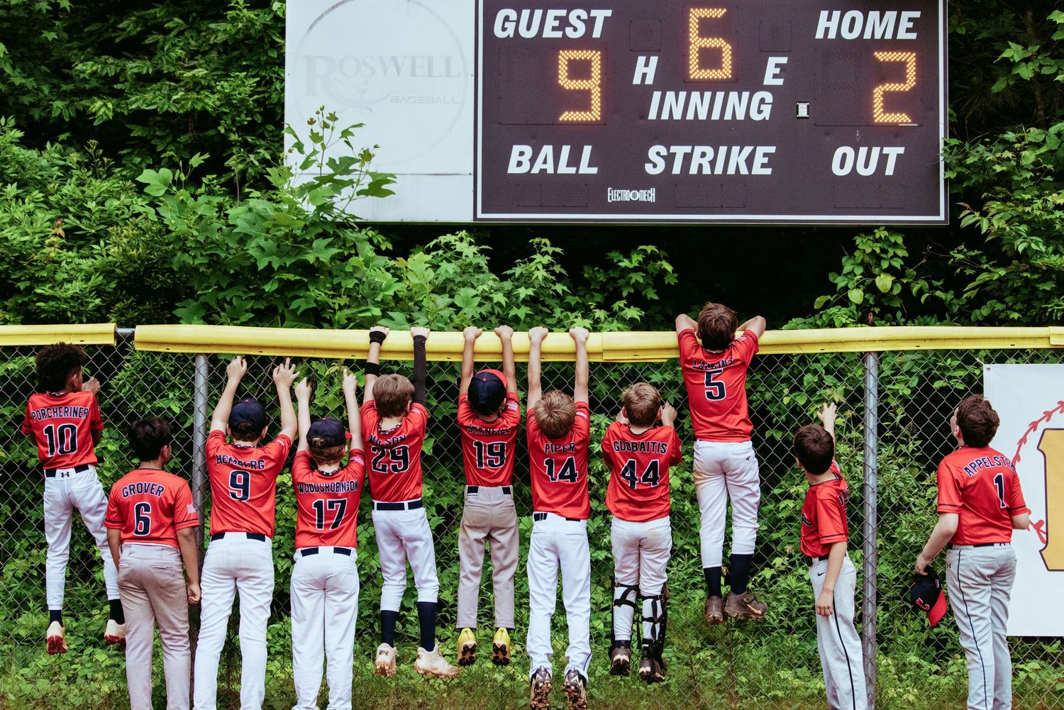 Team photo of boys baseball after win