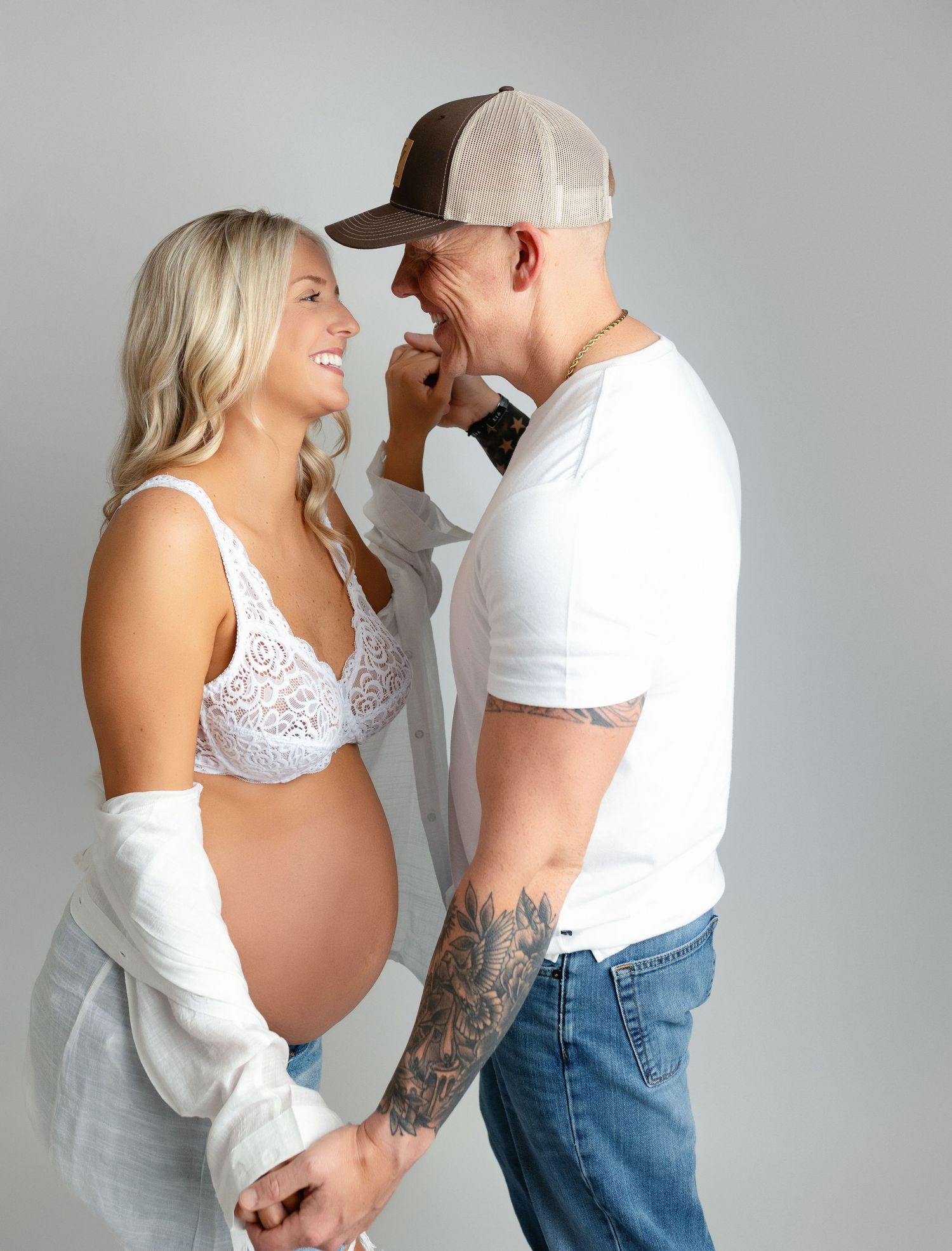 Mom and Dad are facing each other for their maternity shoot session. Greenville, SC newborn photographer, Easley SC newborn photographer