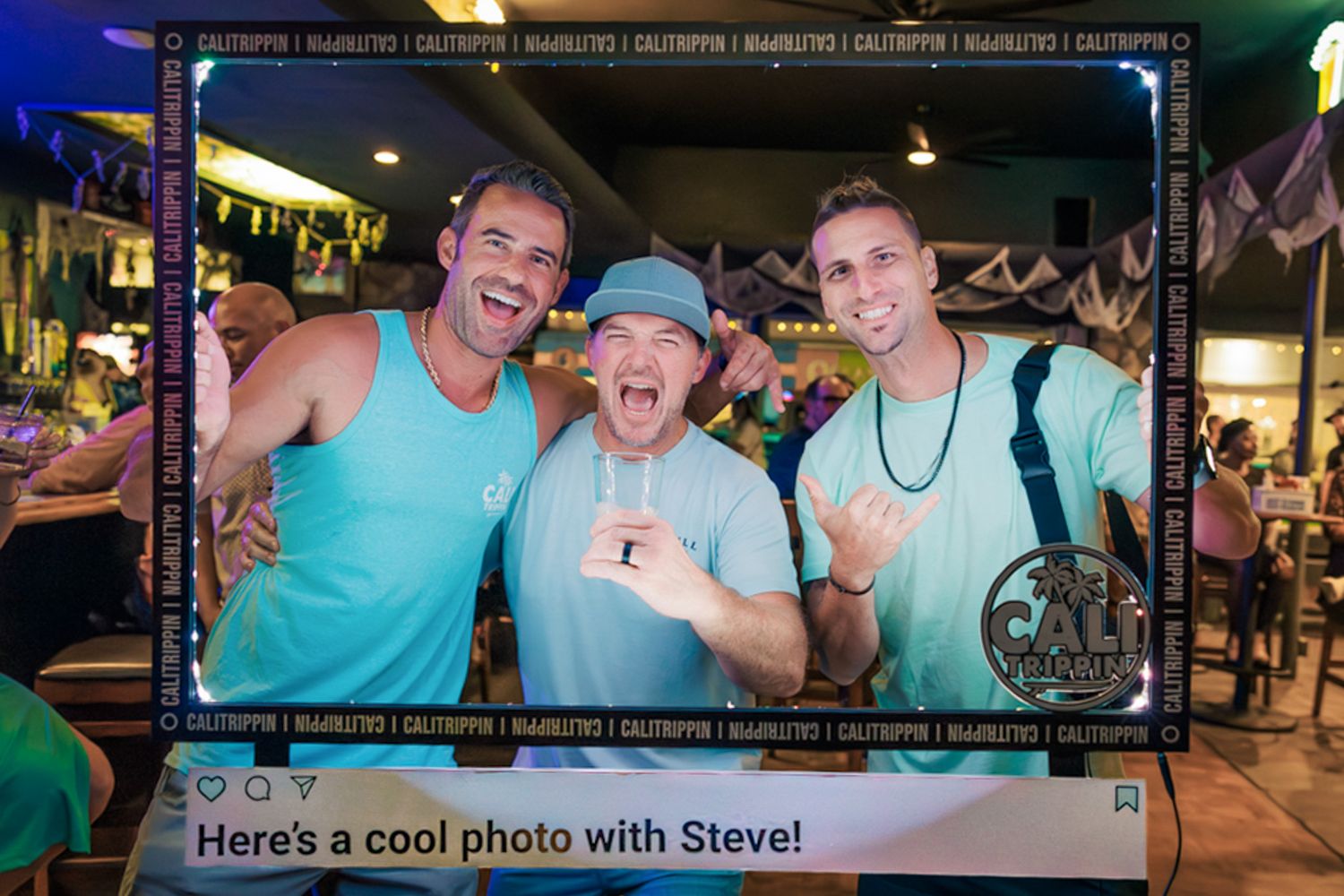 San Diego photographer Steve posing with Dave and Miles from Slightly Stoopid inside a CaliTrippin social media photo frame at the Harp