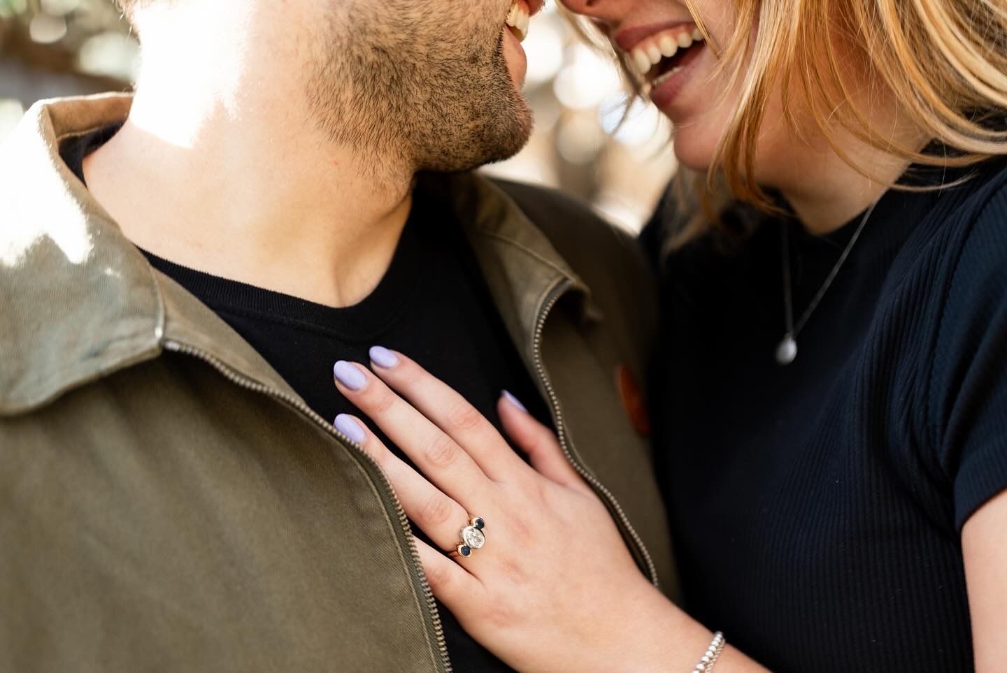 Close-up engagement portrait with genuine smiles and tender moments.