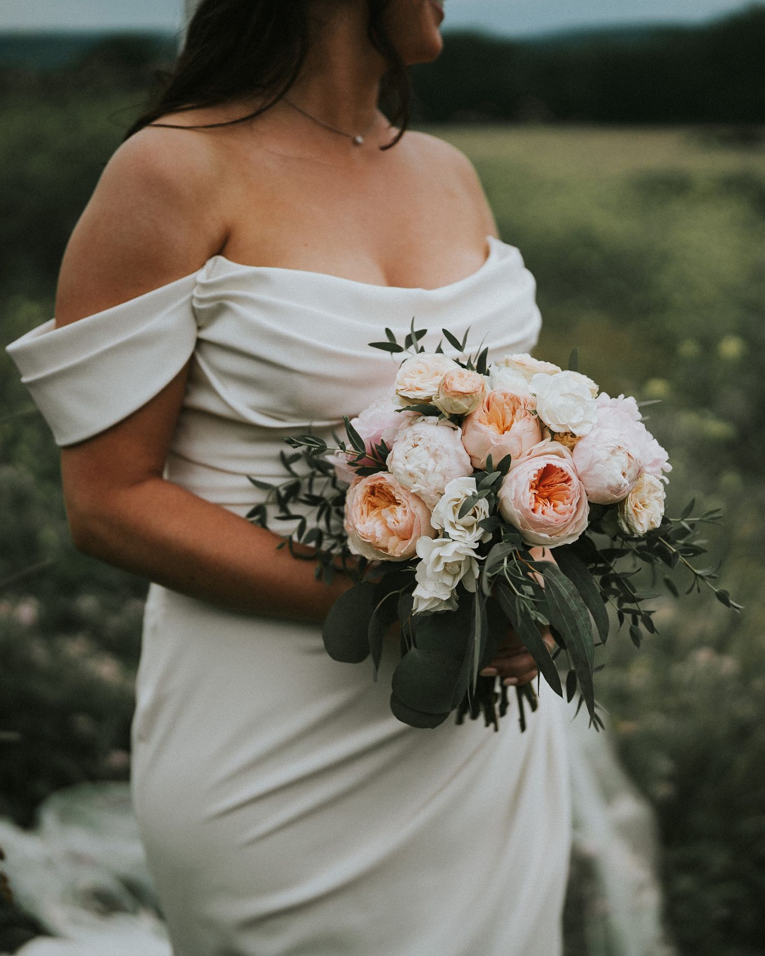 bride holding flowers