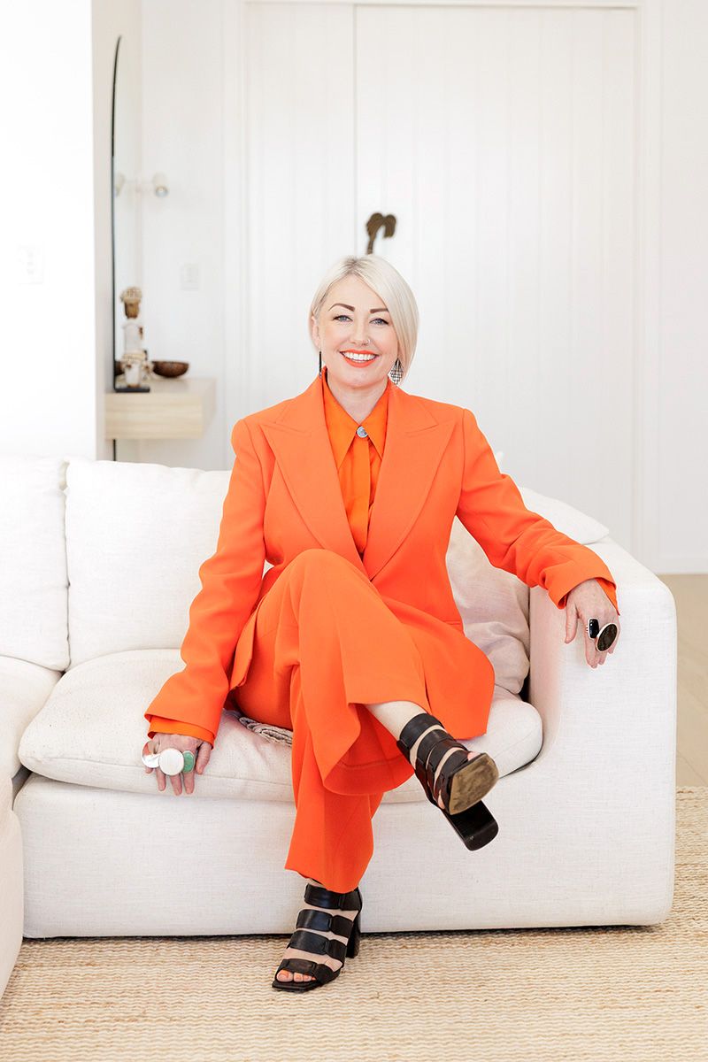 Personal branding photography Adelaide — woman in orange outfit bold business portrait
