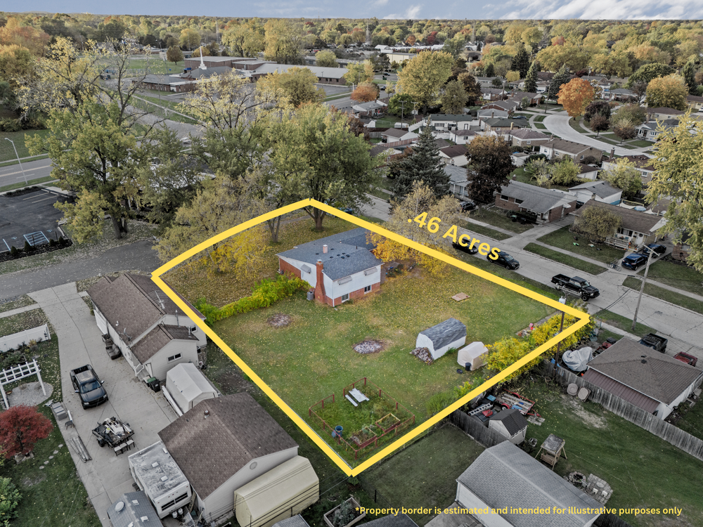 Aerial view of brick ranch home on 0.46-acre lot with outbuilding in suburban neighborhood.
