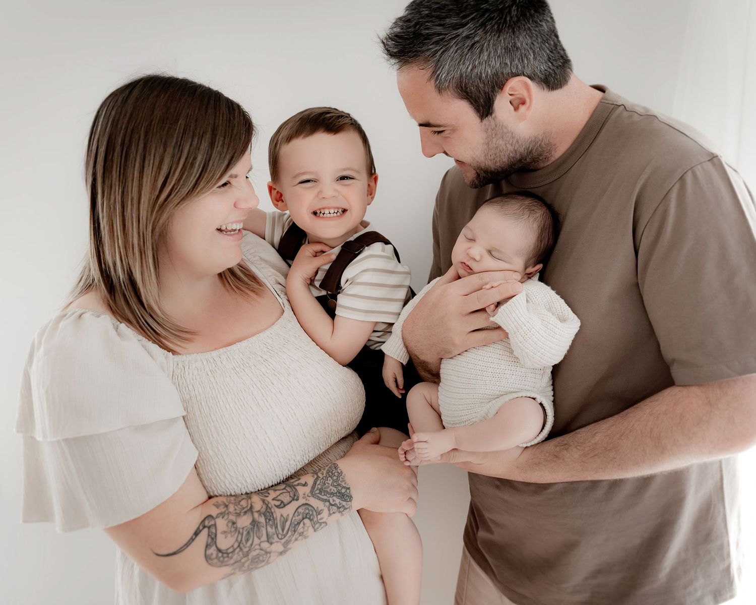Newborn baby photographed in timeless handmade newborn clothing