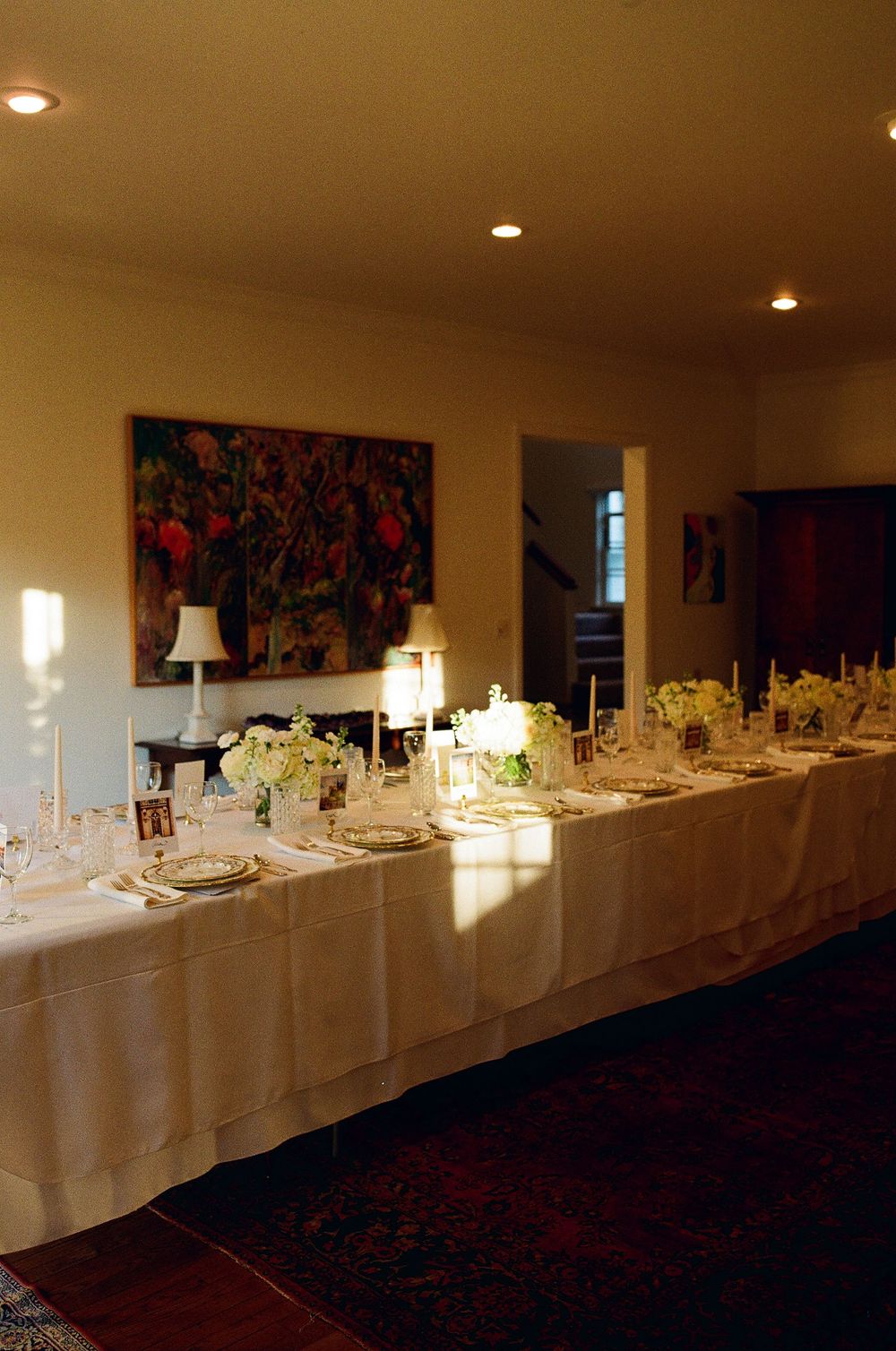 Elegant long-table reception setup at a Hope Ranch estate. Intimate backyard wedding style for CA and NC.