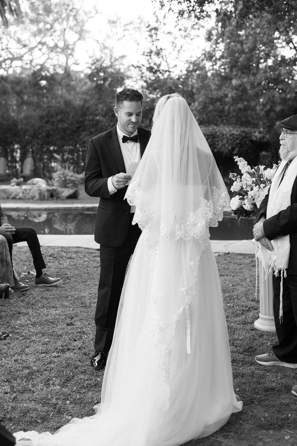 A timeless black and white portrait of a wedding, captured using gentle, natural directional light.
