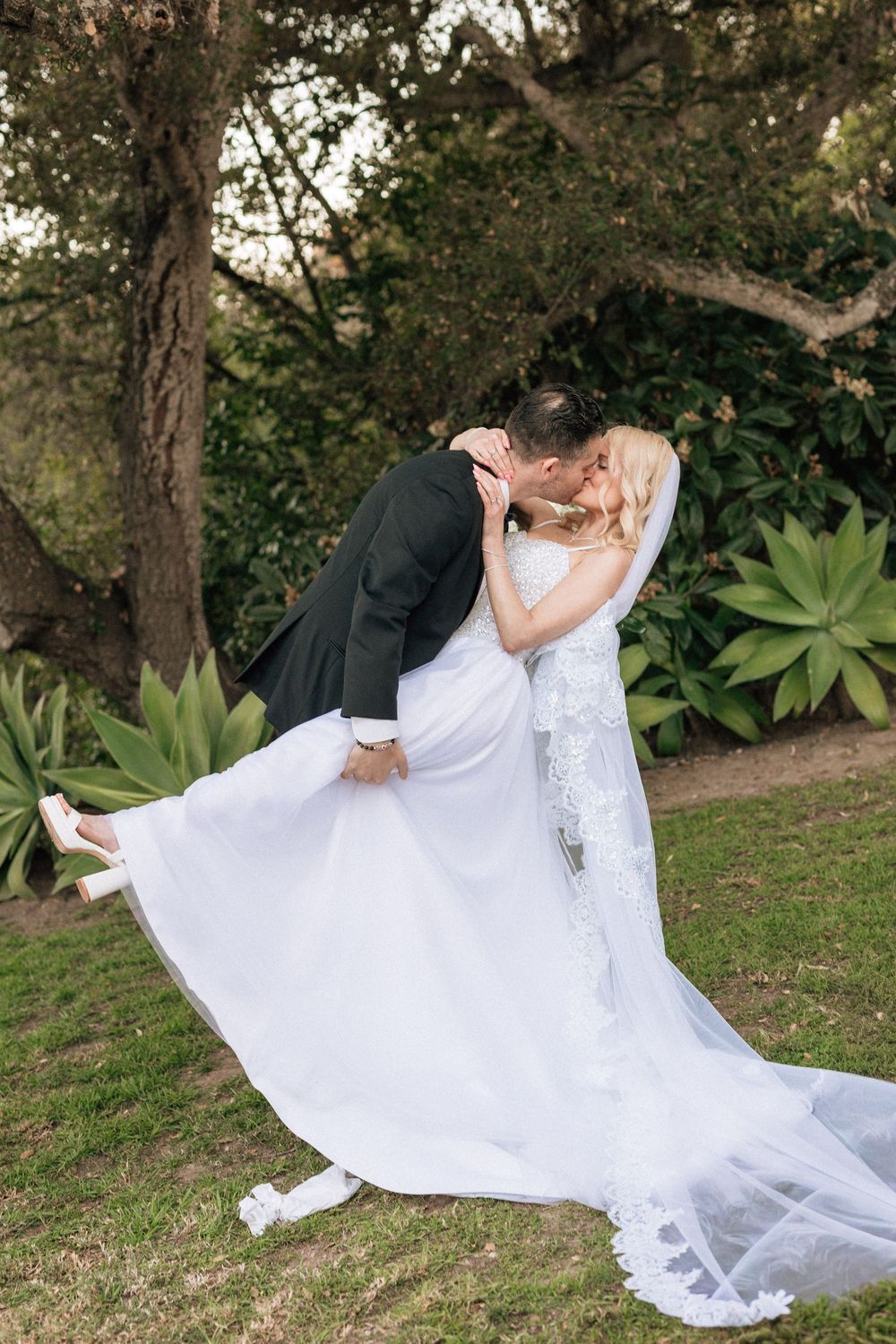 Groom and bride share first kiss captured on film by a CA and NC photographer