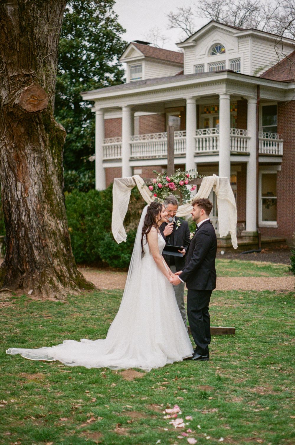 35 mm film shot of bride and groom exchanging vows