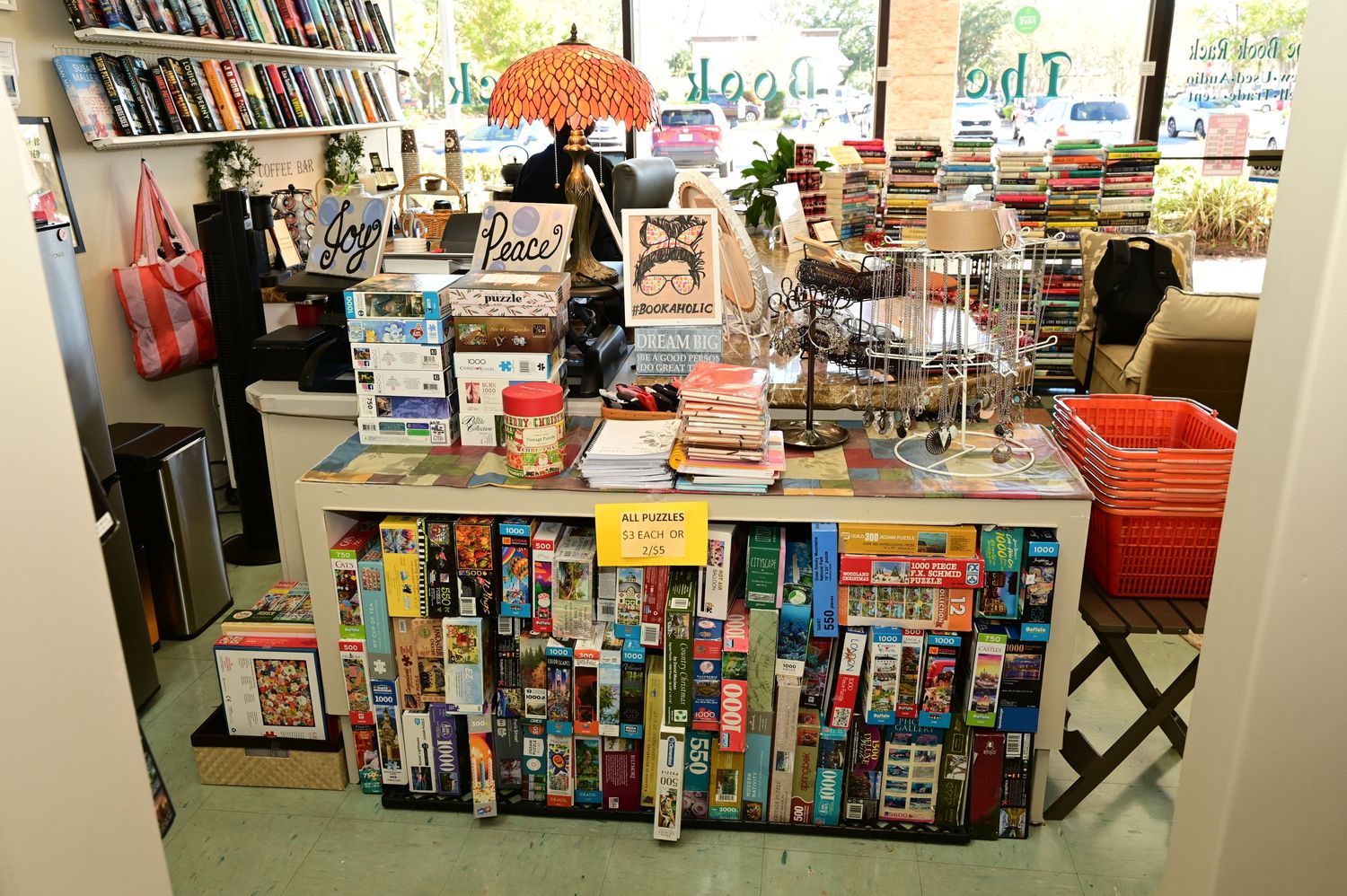 Panoramic shot of a bookstore interior with extensive book displays and reading areas.