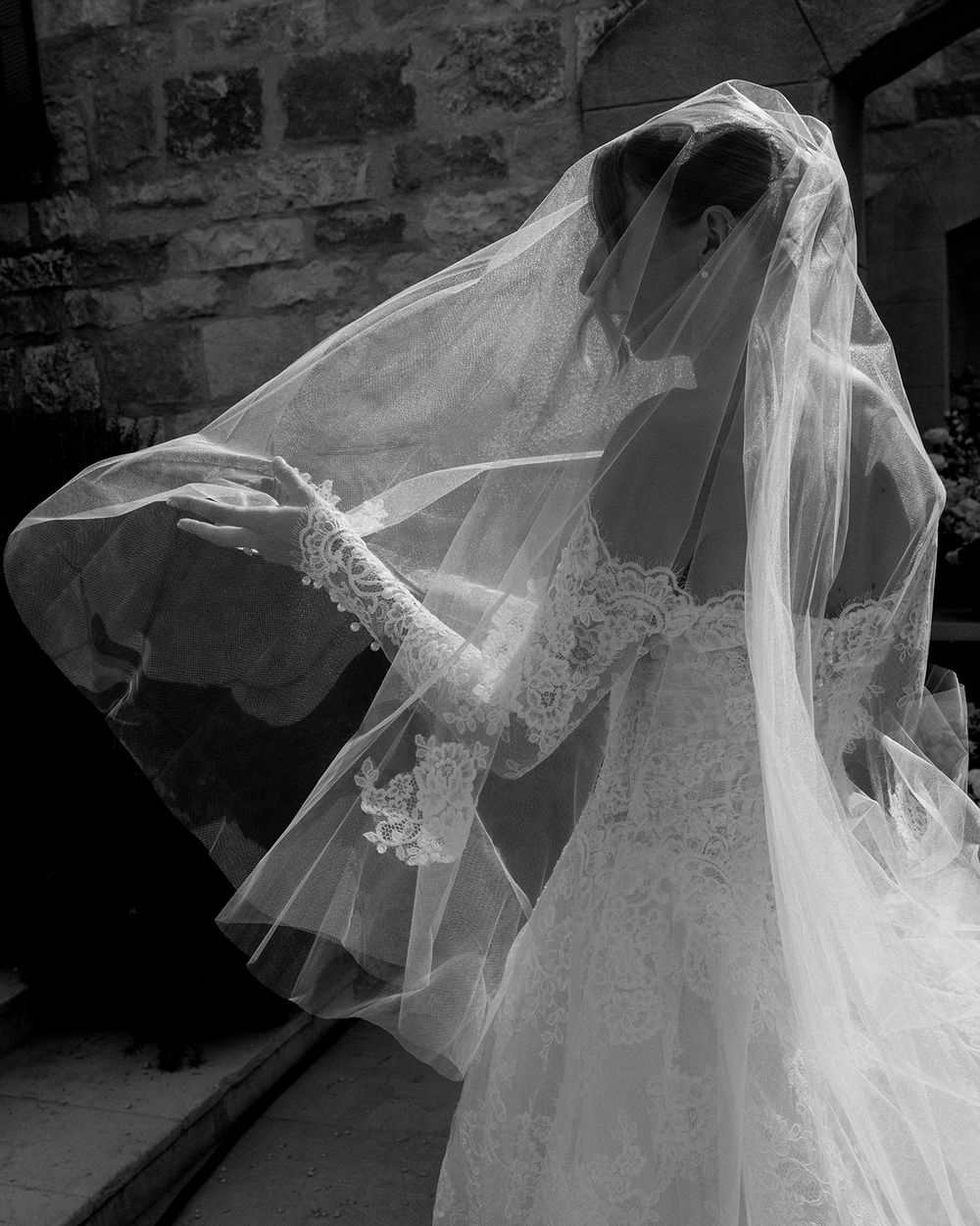 Artistic black and white photo series showing a flowing bridal veil in motion.