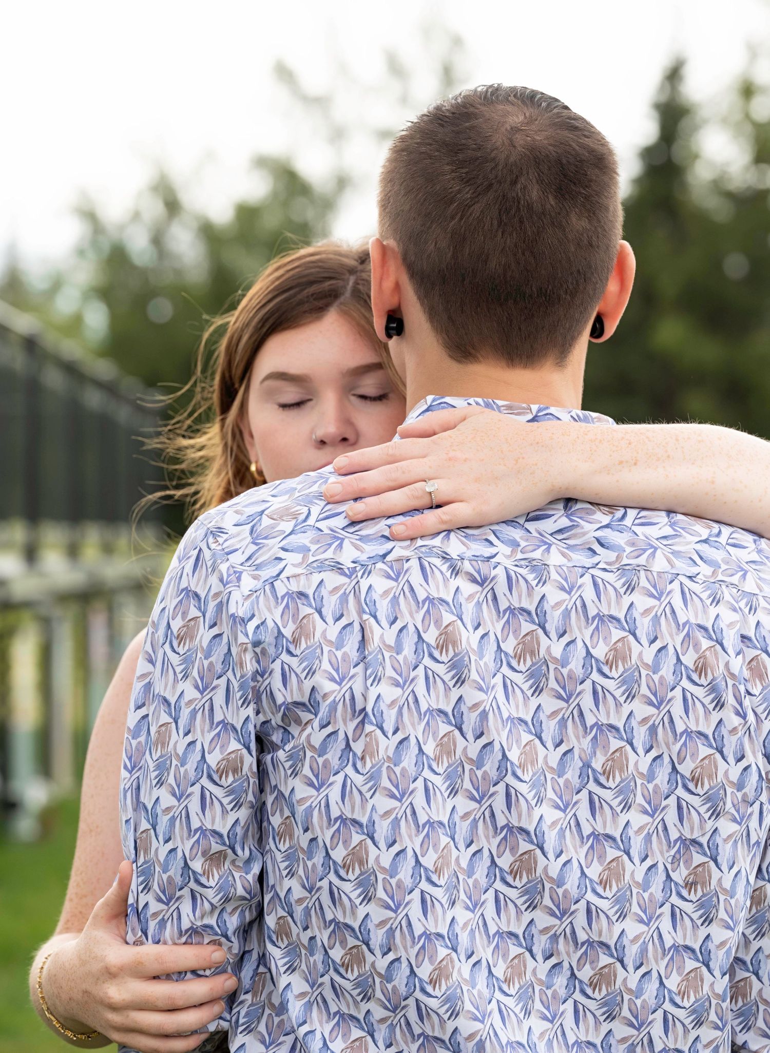Intimate portrait sequence shows couple embracing and sharing emotional moments outdoors.
