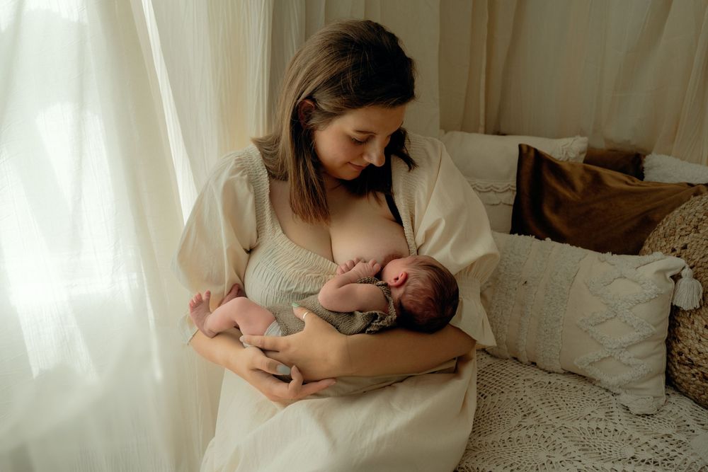 Mother breastfeeding newborn baby