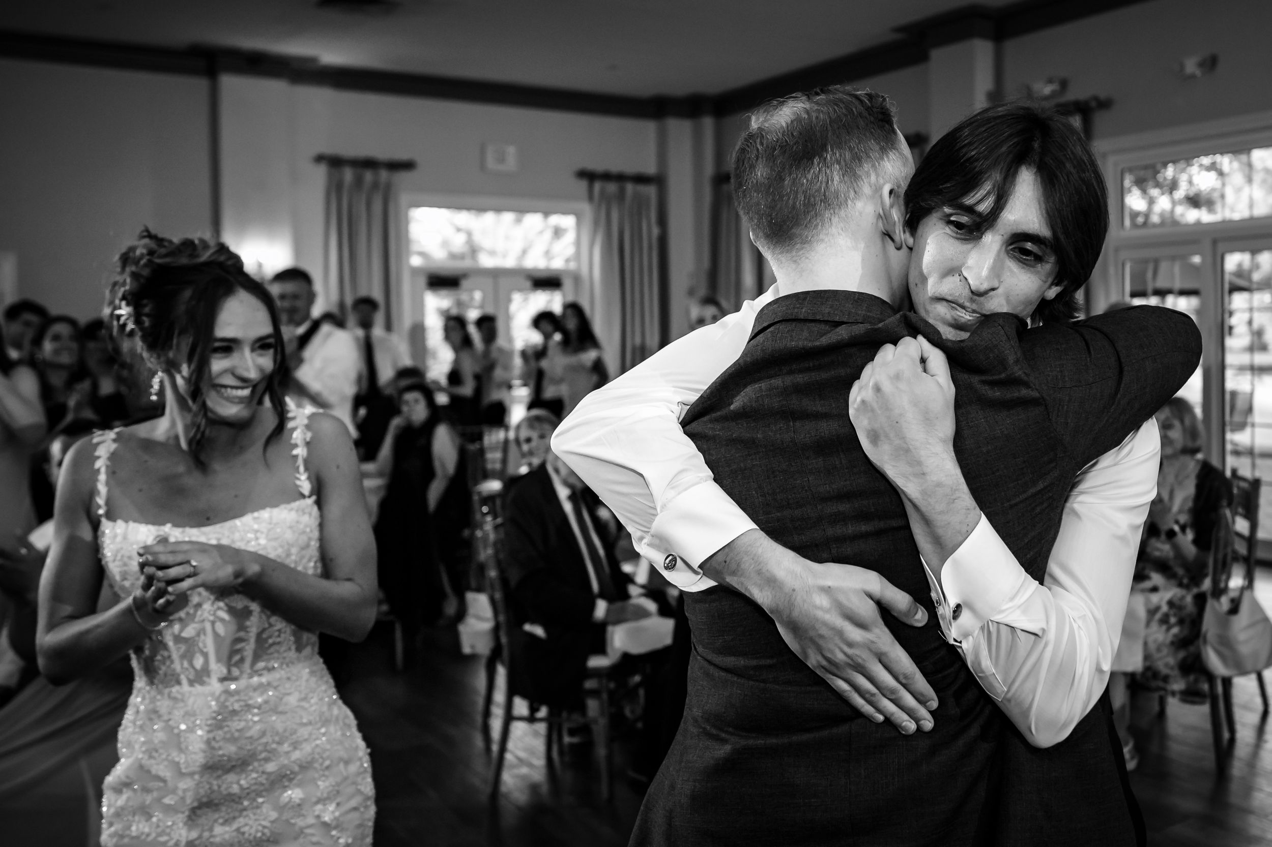 Black and white photos capture intimate moments during wedding reception celebrations.