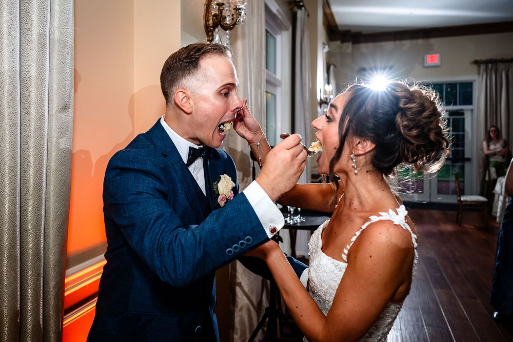 Wedding reception dance floor filled with colorful lights and celebration.