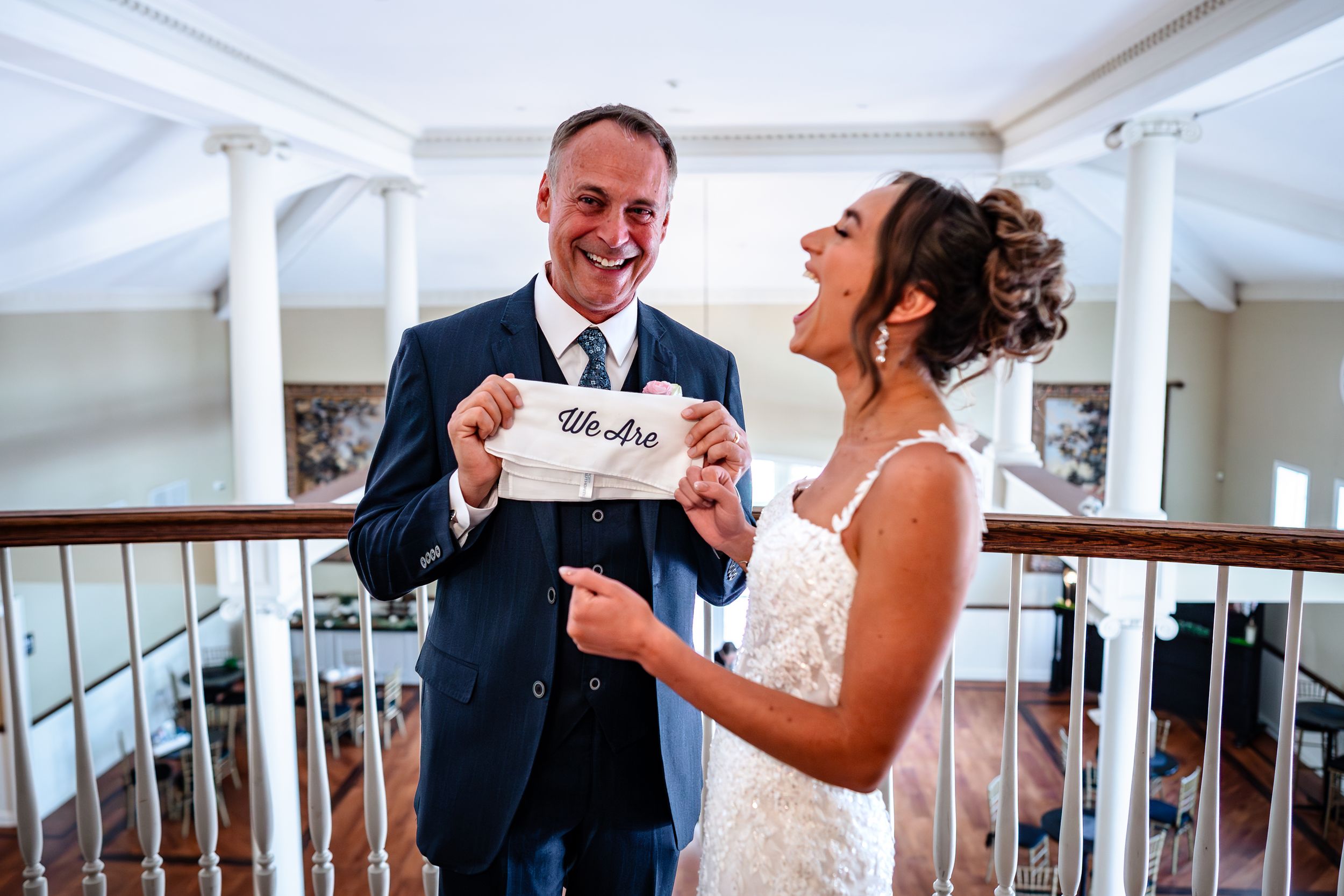 A joyful moment shared while reading a letter during wedding preparations.