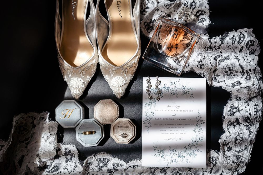 Close-up of elegant bridal shoes with sparkly details and decorative lace.