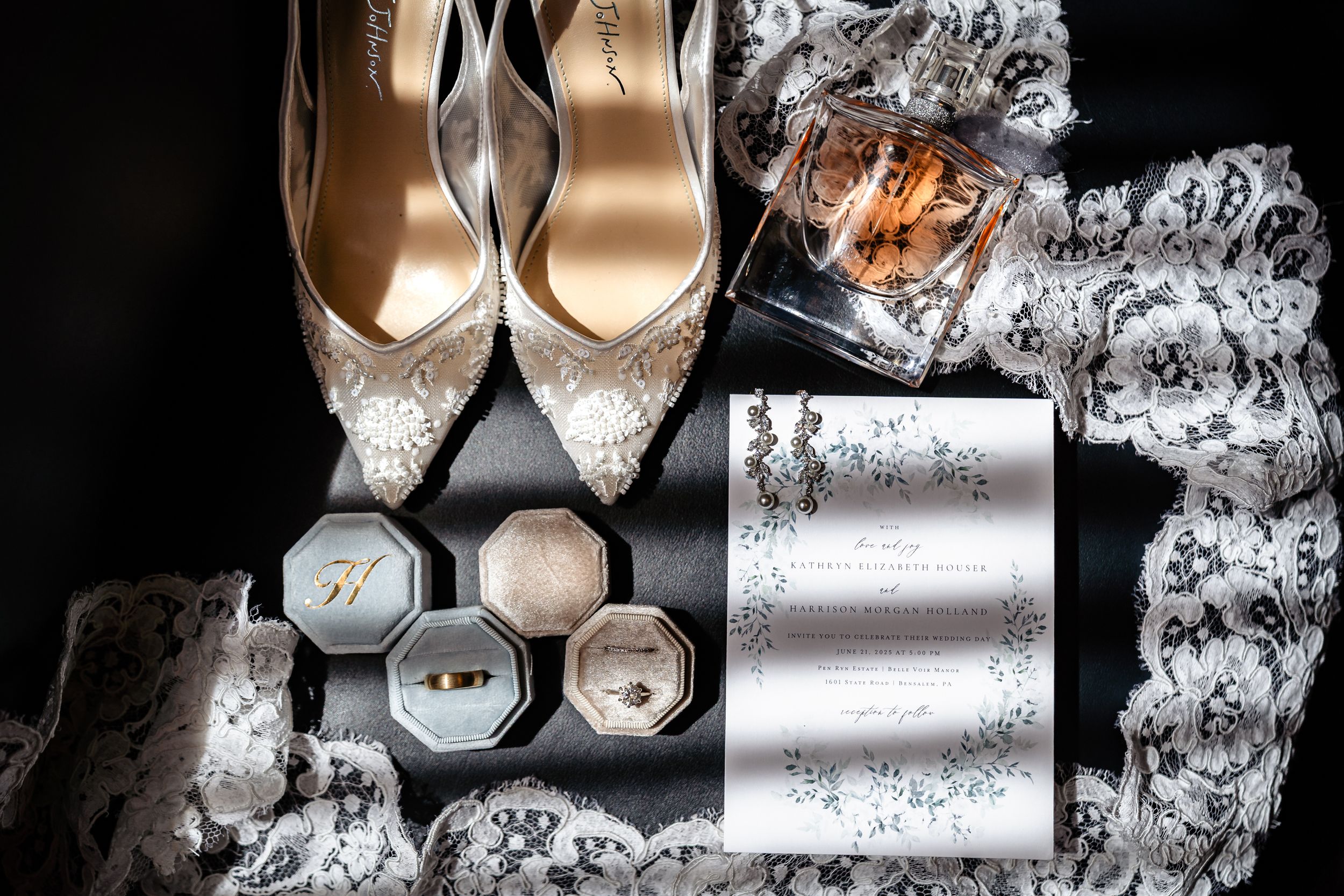 Close-up of elegant bridal shoes with sparkly details and decorative lace.