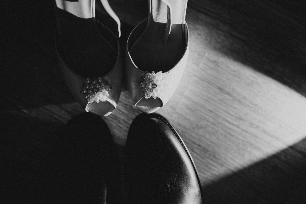Artistic black and white detail shot of wedding accessories.