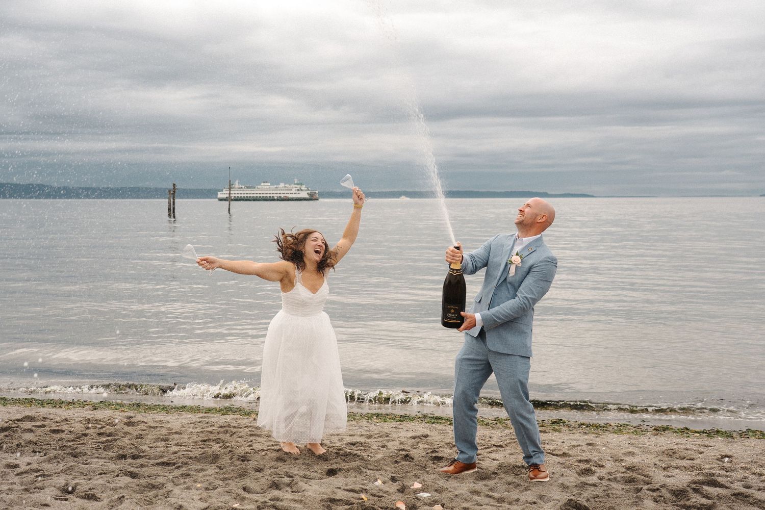 A collage of romantic beach wedding photos showing a couple celebrating against an overcast shoreline background.