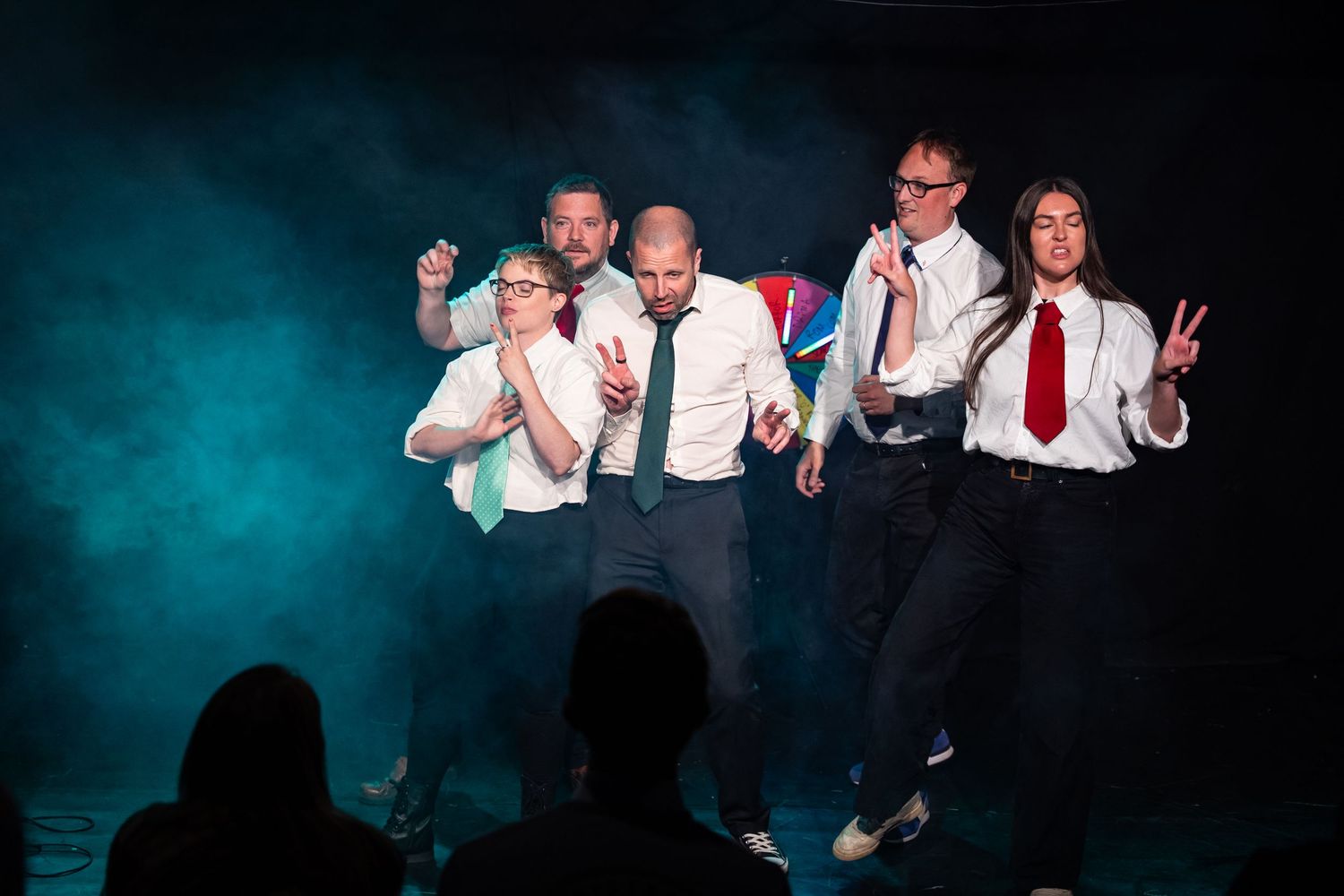 comedy photography Brighton a group of actors Stand on a smoke filled stage doing improvised comedy