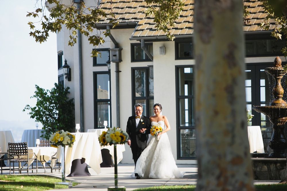 Wedding ceremony site at Summit House with white pillars and stone architecture.
