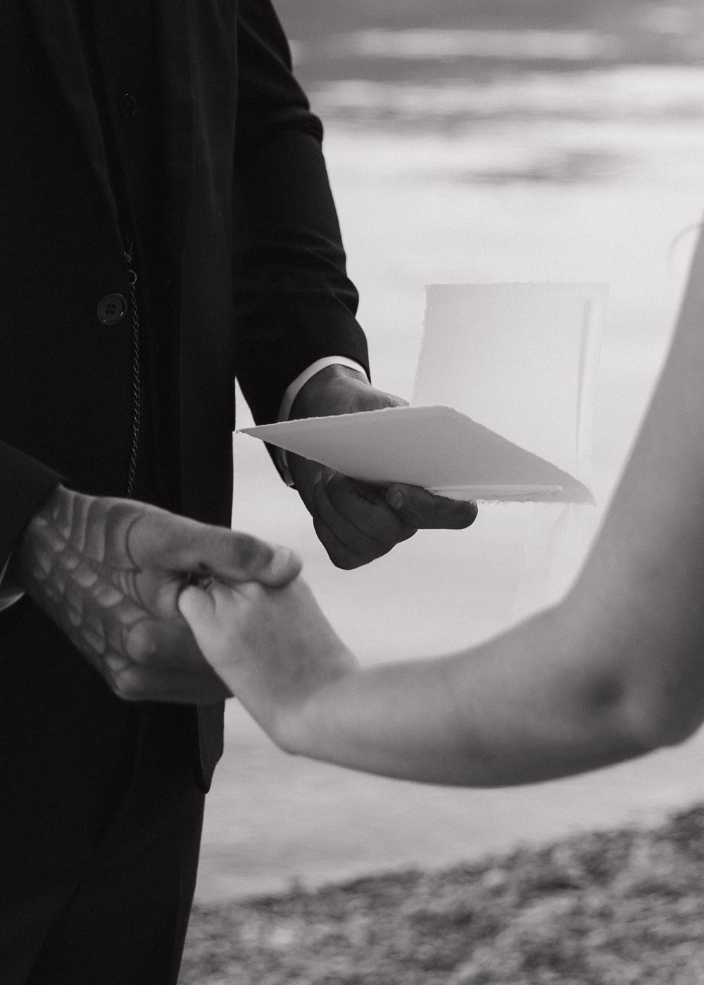 A series of black and white photos showing close-up shots of hands exchanging documents or papers.