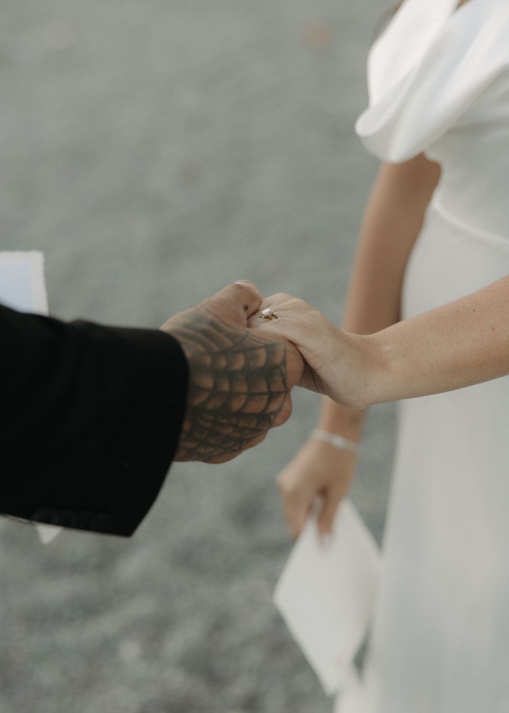 Close-up sequence of two hands shaking then breaking apart showing stages of a formal business handshake.