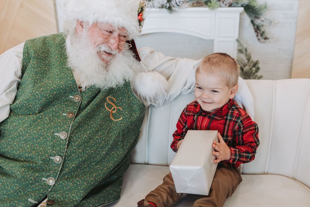 A festive holiday photo collage featuring heartwarming moments between a baby and Santa Claus in a cozy indoor setting.