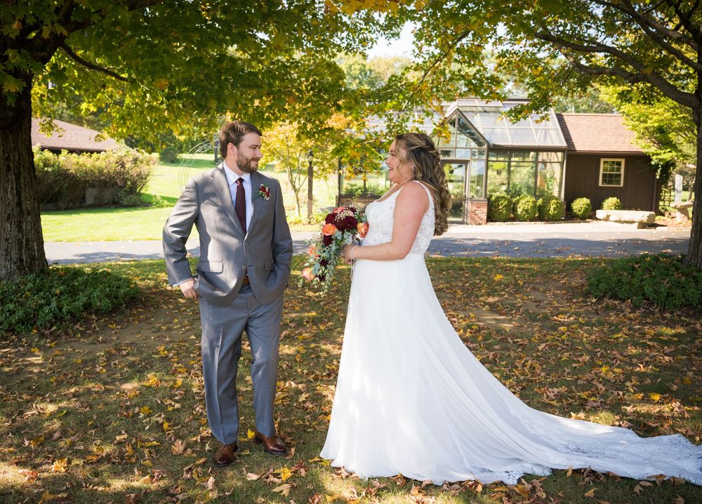 Wedding photo sequence under autumn trees with fallen leaves on the ground.