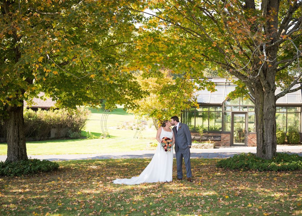 Outdoor wedding photography sequence with beautiful fall foliage and natural lighting.