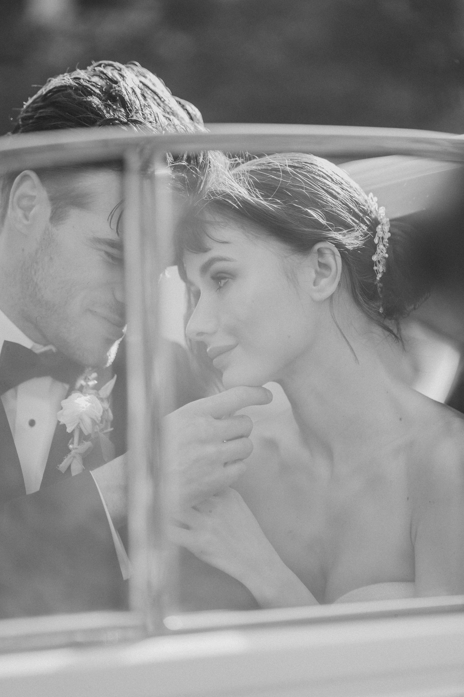Black and white series of romantic moments shared through a car window.