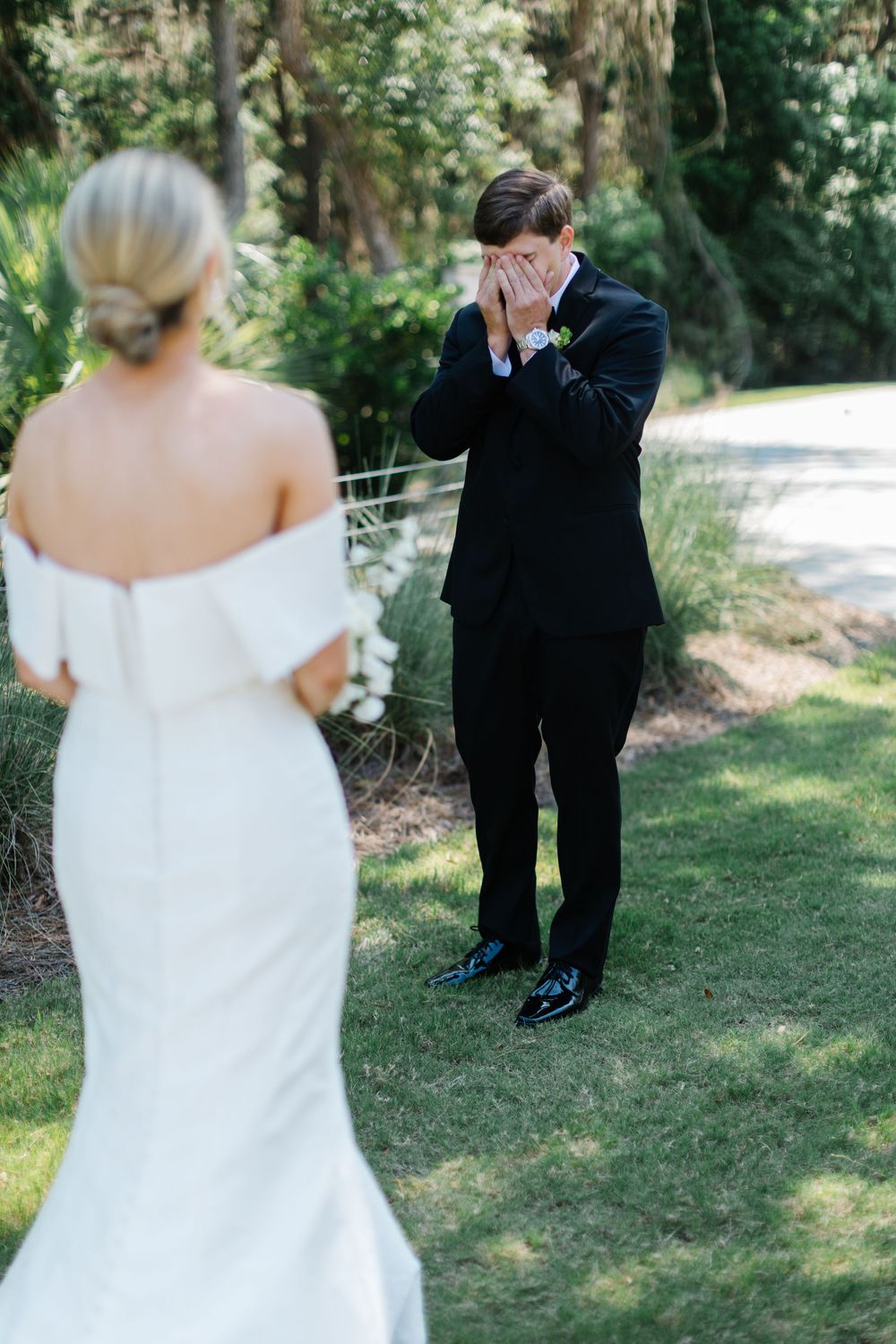 A wedding first look moment captured in a series of photos showing the couple meeting forbes farm st simons